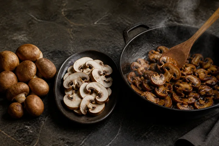 Mushrooms progress from whole to sliced to evenly browned in a pan.