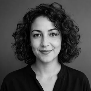 Black-and-white illustrative portrait for Mira G.T.; AI-generated, not a verified likeness.